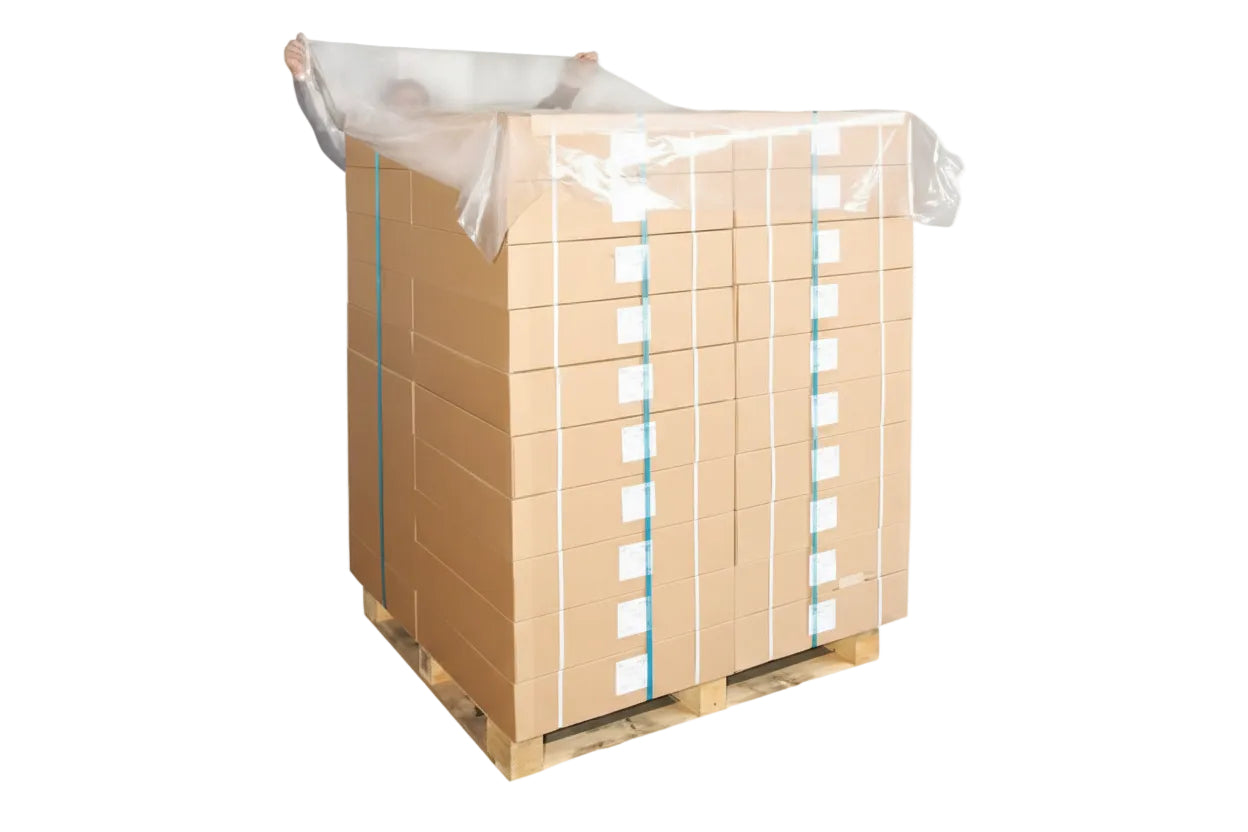 Wooden pallet with a plastic sheet on top against a white background