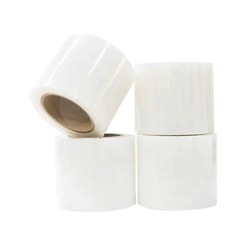 Four rolls of white tape stacked on a white background